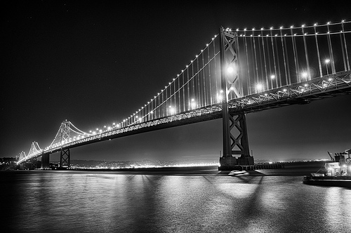 Moon Captured by the Bay Bridge - Black & White by Harold Davis